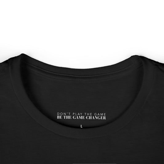 A close up on a t-shirt that shows the label for the brand don't play the game be the game-changer in white text