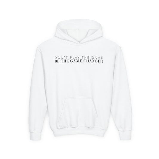 A kids white hoodie with  a kangaroo pocket and black letters that say don't play the game be the game-changer across the chest