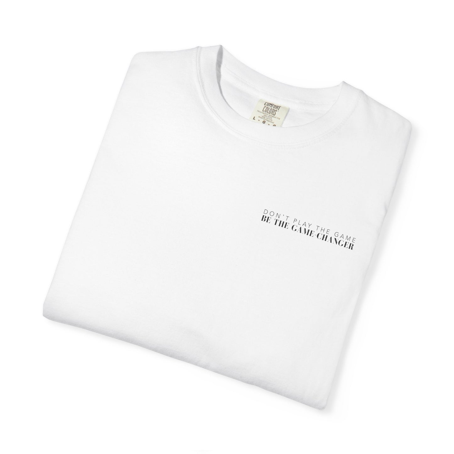 A folded short sleeve white t-shirt with black letters that say don't play the game be the game-changer across the left chest