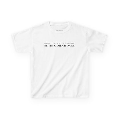 A kid's short sleeve white t-shirt with black letters that say don't play the game be the game-changer across the chest