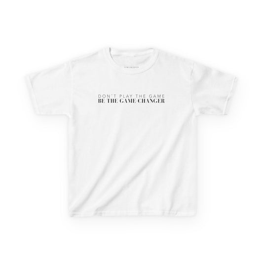 A kid's short sleeve white t-shirt with black letters that say don't play the game be the game-changer across the chest