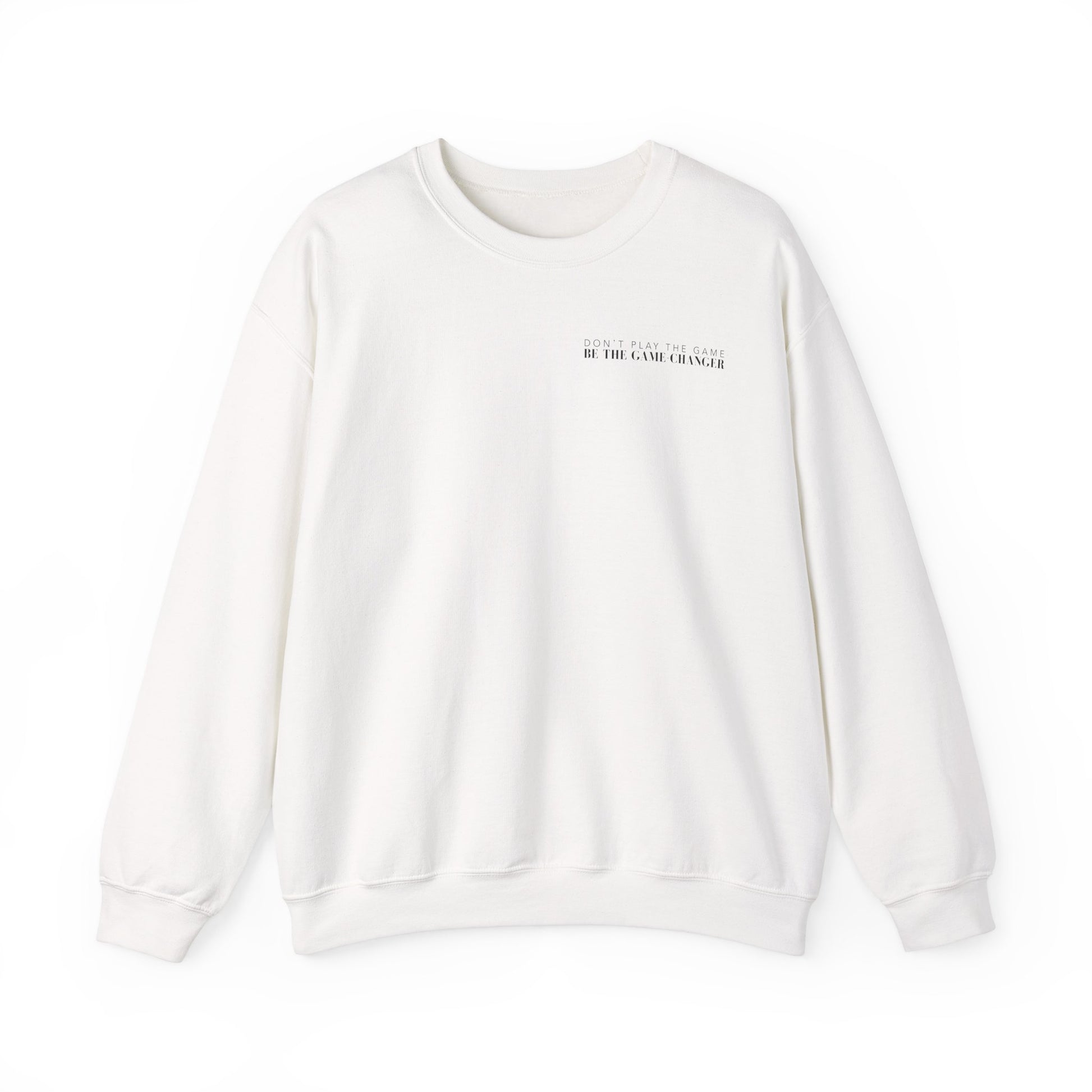A cozy white crewneck sweater with black letters that say don't play the game be the game-changer over the left chest 