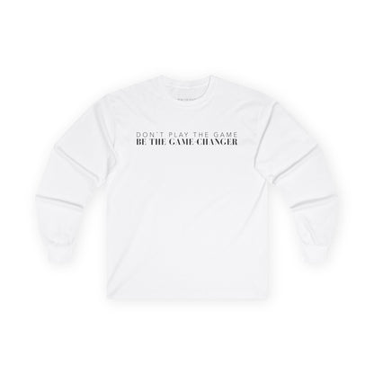A long sleeve white t-shirt with black letters that say don't play the game be the game-changer across the chest