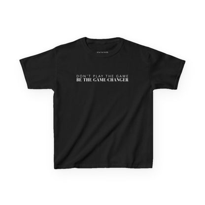 A kid's short sleeve black t-shirt with white letters that say don't play the game be the game-changer across the chest