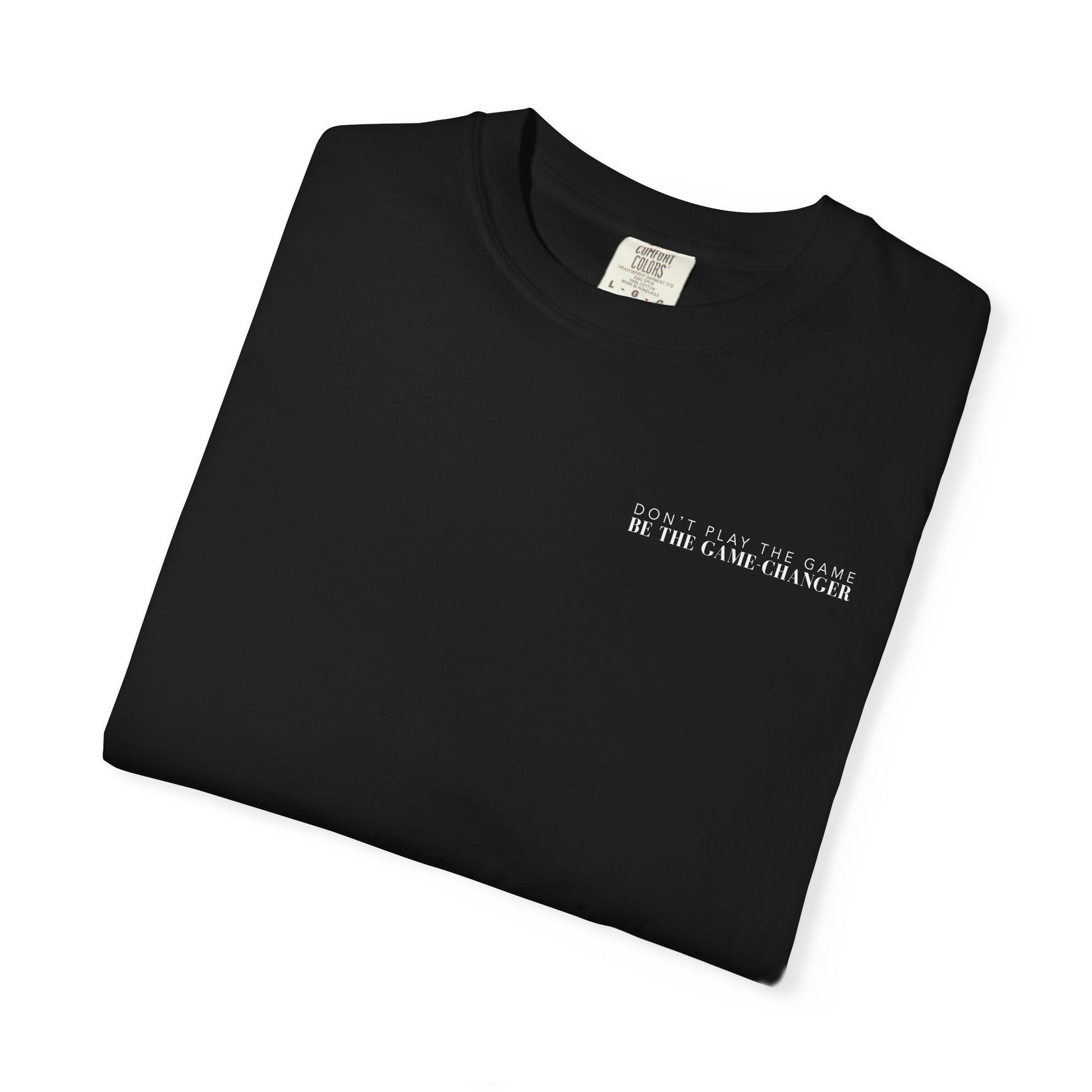 A folded short sleeve black t-shirt with white letters that say don't play the game be the game-changer across the left chest