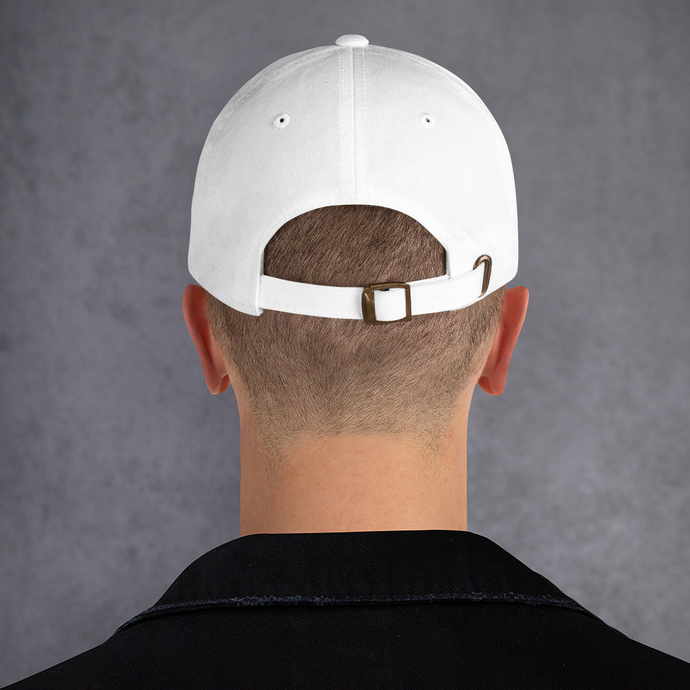 a backside view of a man wearing a white baseball cap with a metallic fastener